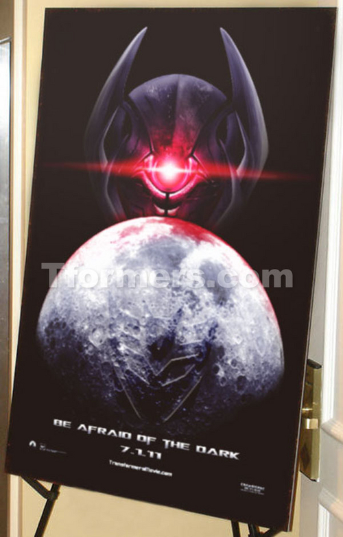 transformers dark of the moon poster. The bottom of the poster reads