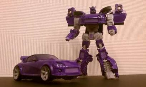 BotCon 2012 - Custom Class Exclusive Figure is Shattered Glass Longarm with Parts To Convert To Shockwave As Bonus