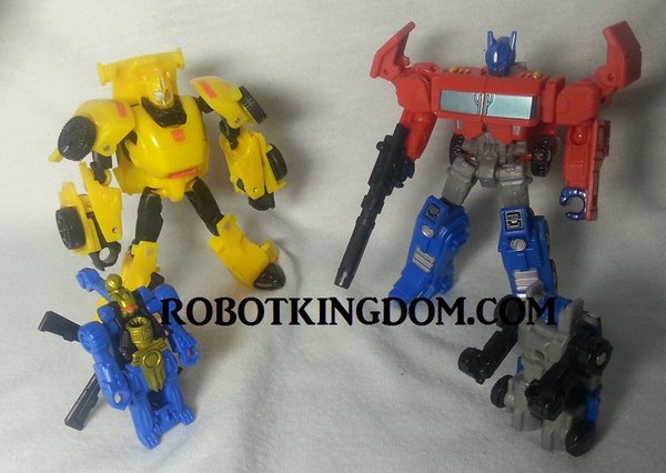 Transformers Generations Optimus Prime with Roller and Bumblebee In-Hand Images